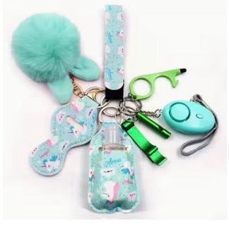 Set of keychains with a bottle holder, green clip, and other accessories