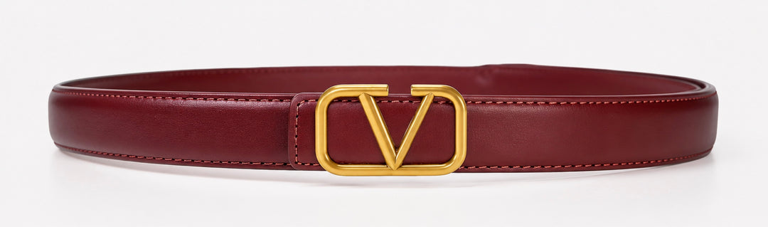 Women’s V buckle belt with gold-tone statement buckle and stitched edging, available in burgundy, white and tan.