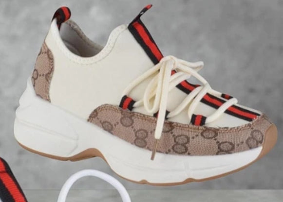 Side view trainers in beige and cream colour with stripe 