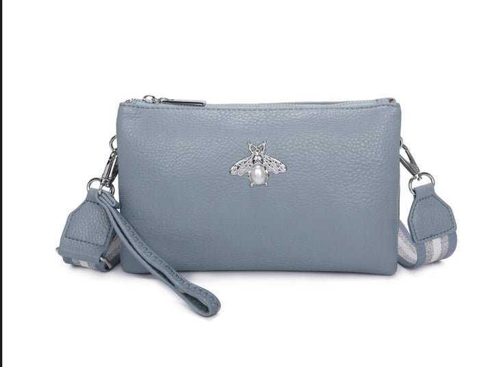Blue handbag with a bee emblem 