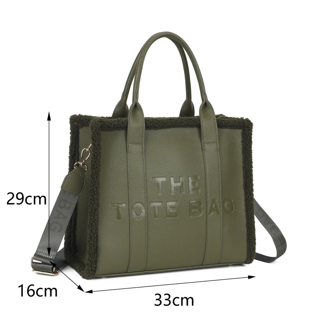 Shop the Large Fuzzy Edge Tote Bag with soft textured trim, embossed lettering and detachable shoulder strap. A spacious everyday bag in seasonal colours.