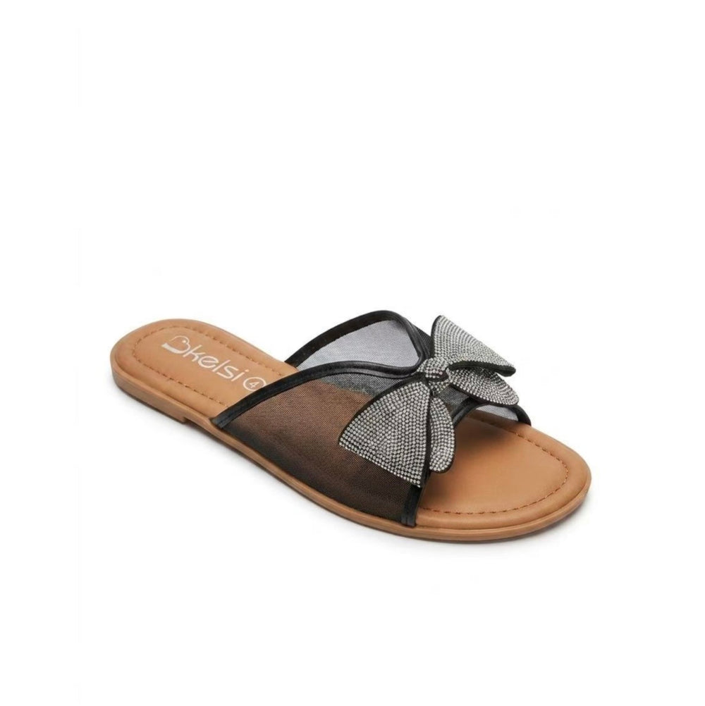    Close-up of rhinestone bow detail on black sandals