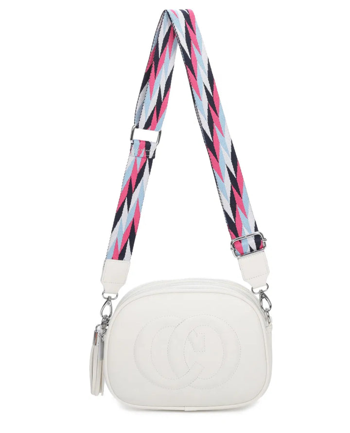 A animal patterned strap cross body bag with a detachable and adjustable strap, featuring multiple zipped compartments and golden tone metal hardware.