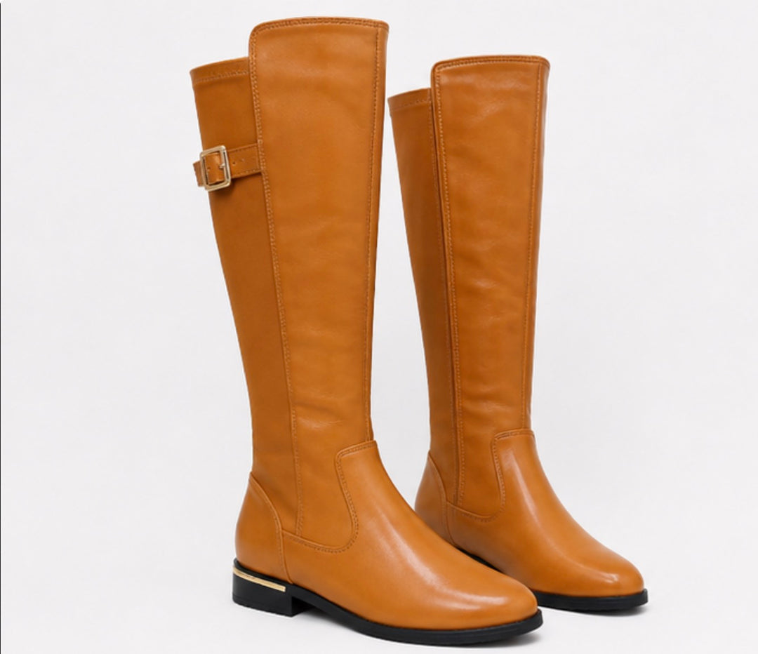 Buckle detail knee high boots available in tan and black patent with low heel