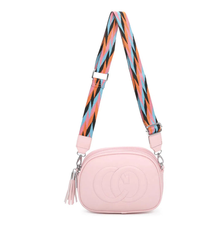 A animal patterned strap cross body bag with a detachable and adjustable strap, featuring multiple zipped compartments and golden tone metal hardware.