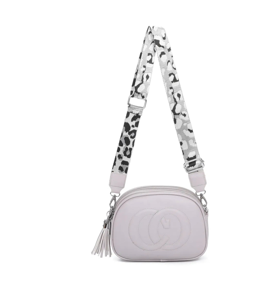 A animal patterned strap cross body bag with a detachable and adjustable strap, featuring multiple zipped compartments and golden tone metal hardware.
