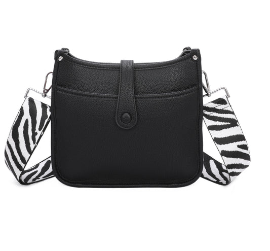 Black handbag with zebra print straps 