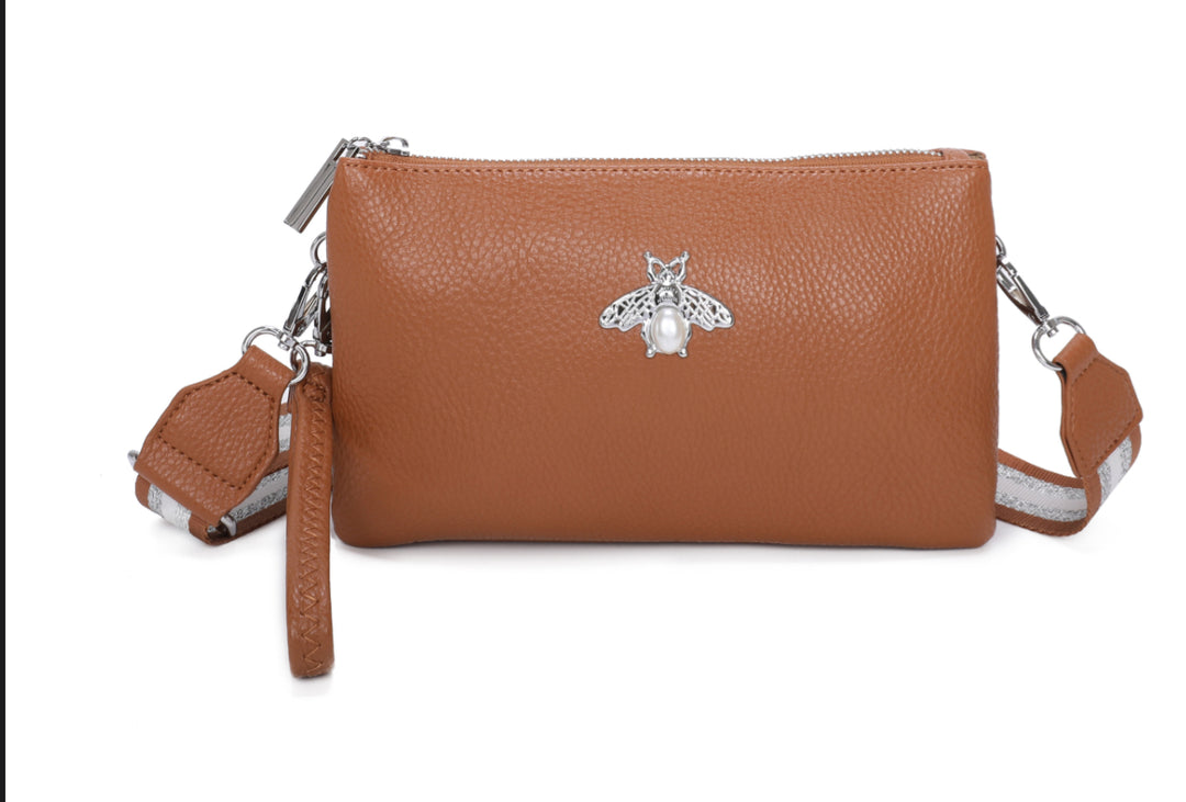 Brown faux leather handbag with a silver bee emblem 