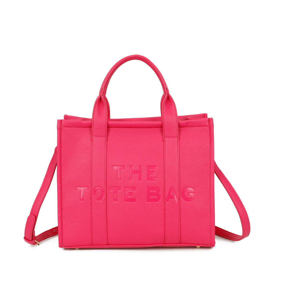 A hot pink tote bag with embossed ‘The Tote Bag’ text, structured design with top handles and detachable shoulder strap