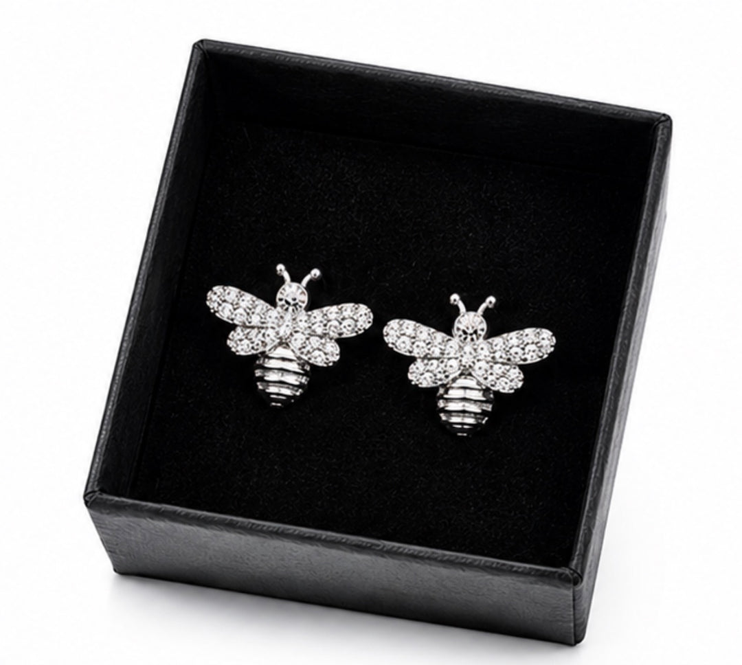 Silver crystal bee stud earrings with sparkling embellished wings and polished silver lined body detailing.