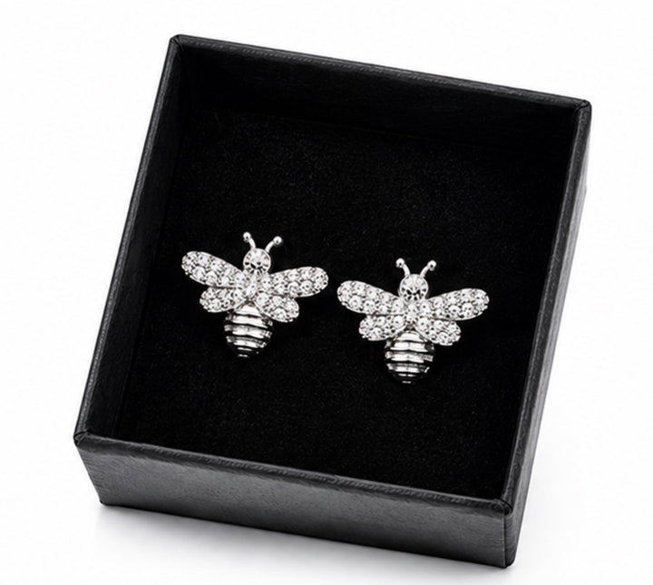 Silver crystal bee stud earrings with sparkling embellished wings and polished silver lined body detailing.