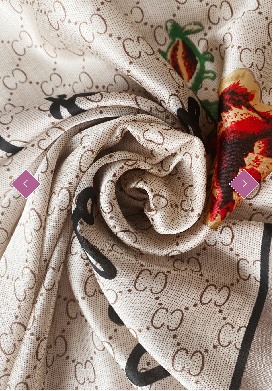 A beige scarf with a geometric pattern and a multicoloured floral emblem.