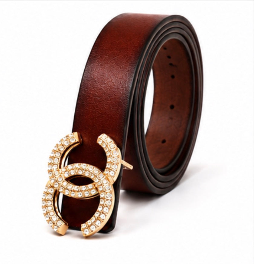 Brown women’s statement belts with three decorative buckle designs including gold-tone crystal and silver-tone buckles.