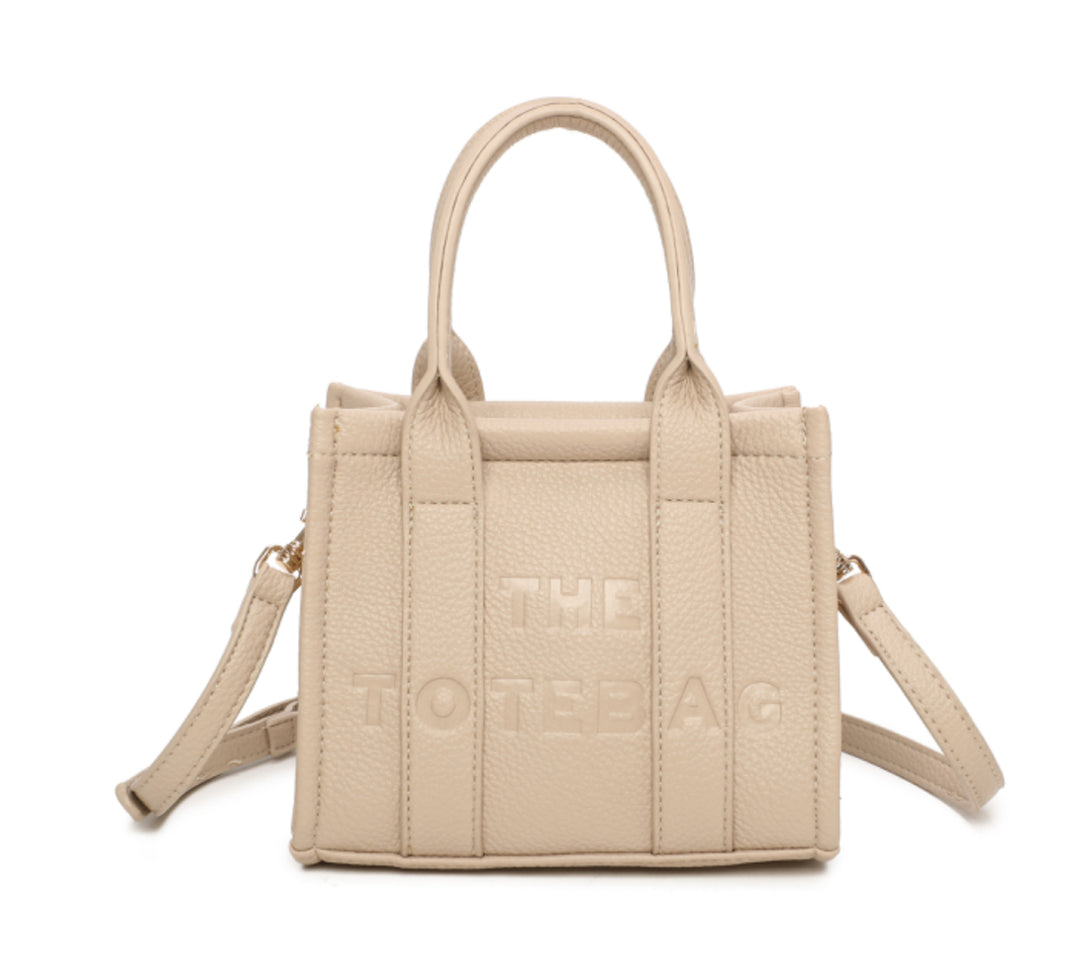 A beige mini tote bag with &