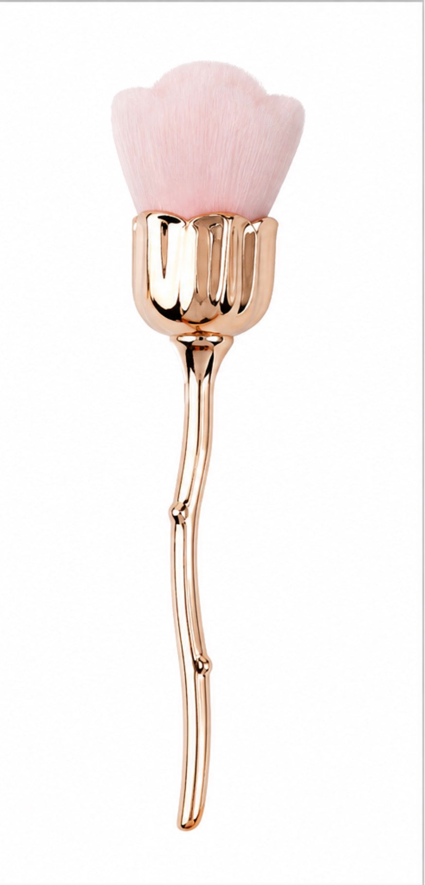 Luxury rose gold flower-shaped dust brush with ultra-soft synthetic bristles and an elegant floral handle for applying and removing finishing powder.