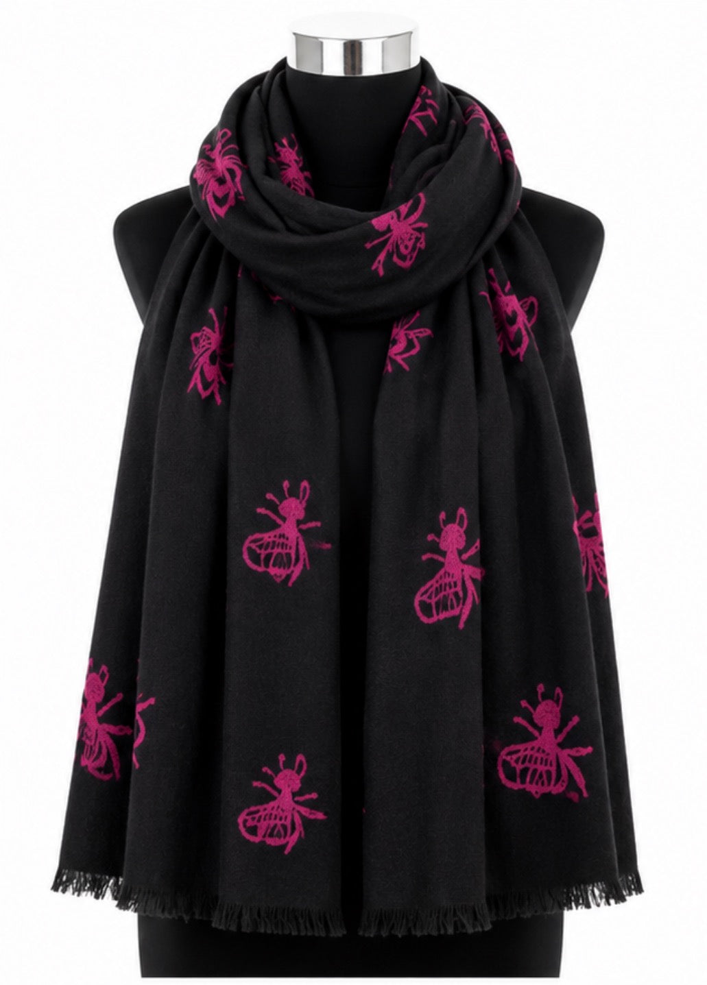 Black soft woven scarf with bright pink bee print and delicate fringed edging.
