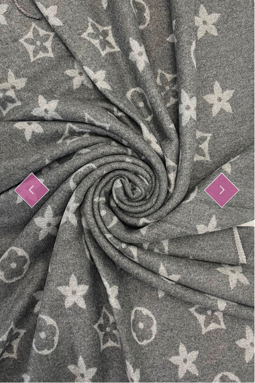 A grey scarf with sparkly metallic thread floral patterns, draped elegantly with a focus on the sparkly details.
