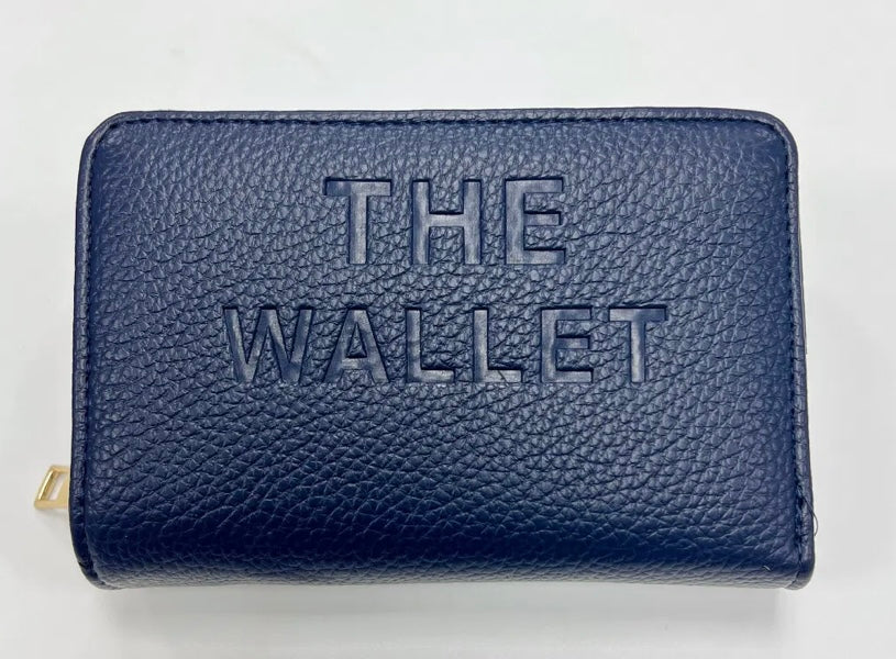 Navy purse with gold hardware and “the wallet” embossed on the front