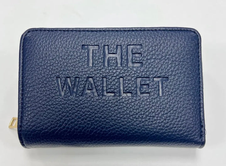 Navy purse with gold hardware and “the wallet” embossed on the front