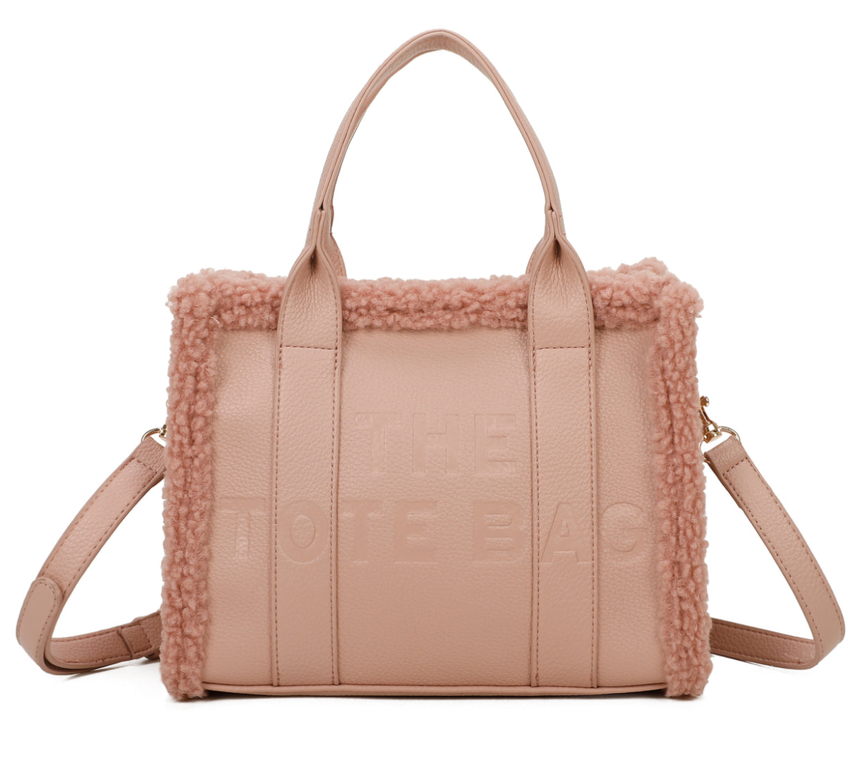 A pink mini tote handbag with debossed details and fuzzy edged trim, featuring an adjustable strap.