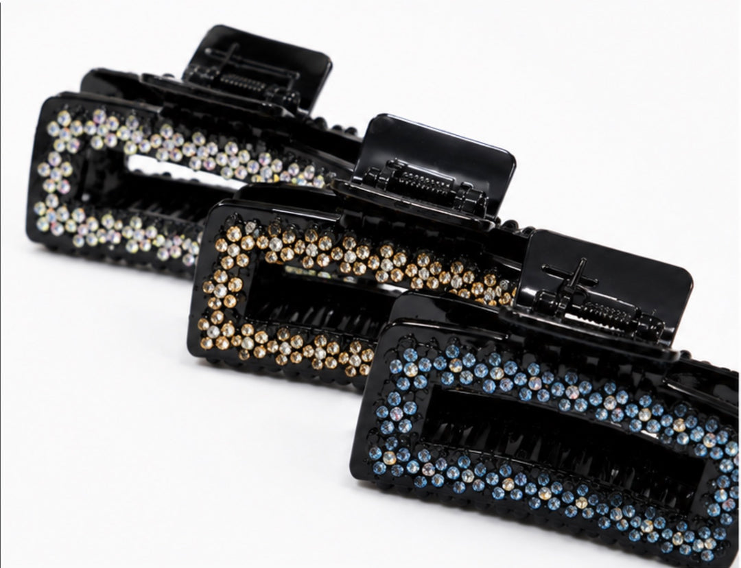 Black rectangular hair claw clip with sparkling rhinestone detailing