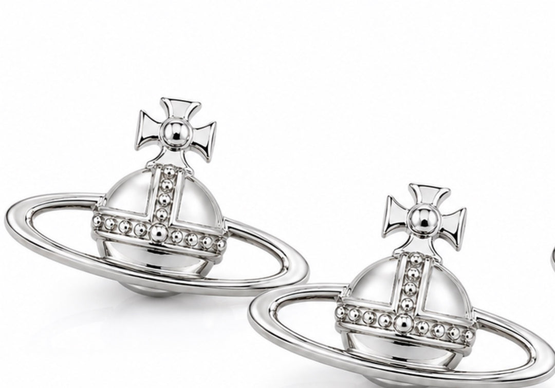 All-silver planet orb statement brooch with ring detail and pin fastening