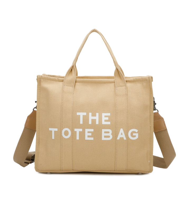 A beige canvas tote bag with &