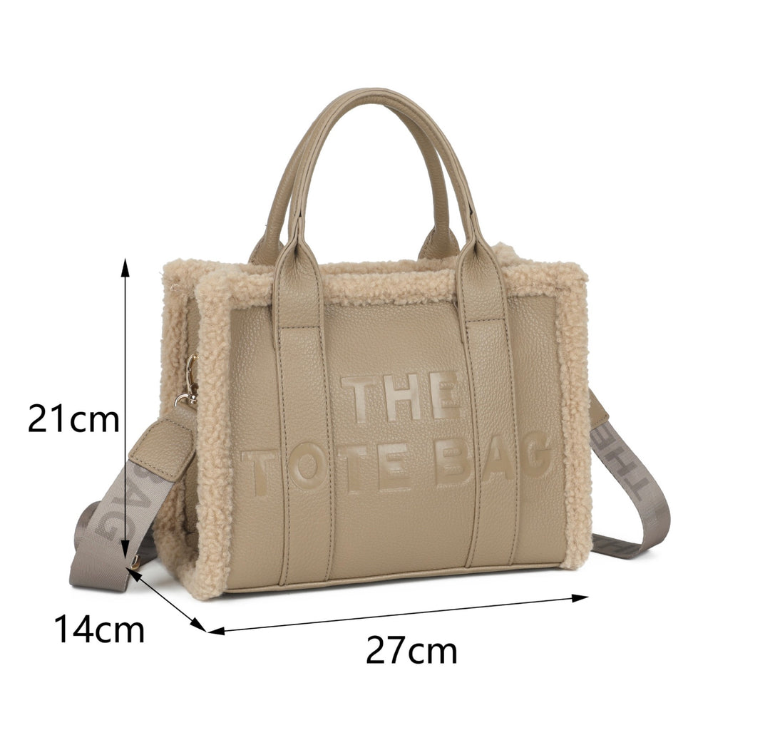 Women’s fuzzy edge tote bag with embossed The Tote Bag lettering, grab handles and detachable shoulder strap