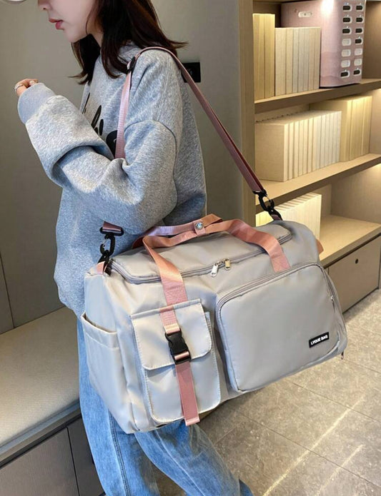 Grey and pink detail back pack rucksack - cross body bag - travel bag holdall