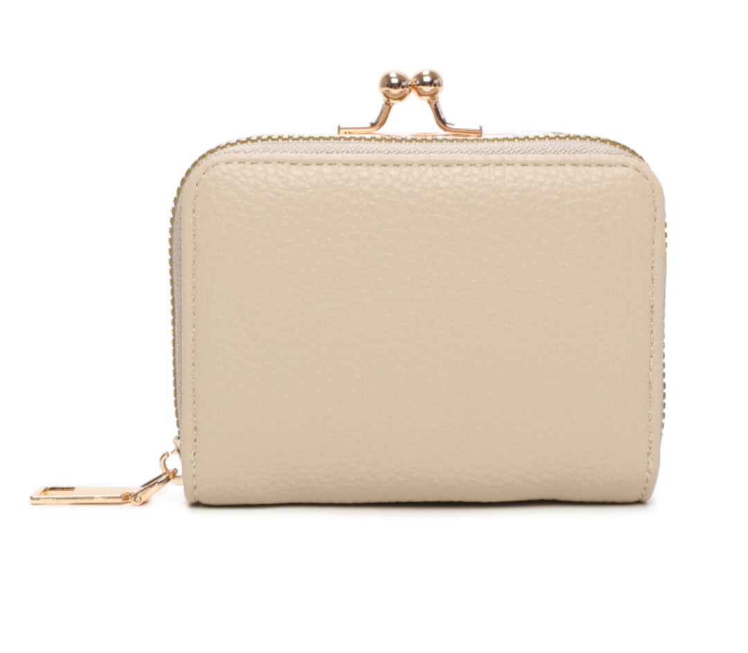 A beige clutch purse with gold detail and a zipper closure.