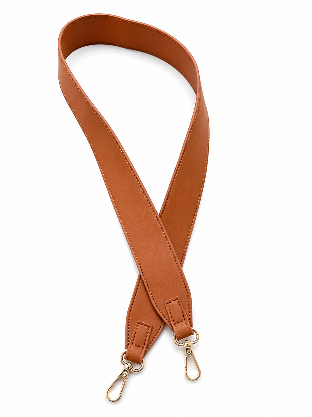 A tan faux leather shoulder strap with gold-tone metal swivel snap hooks on both ends, arranged in a looped shape against a plain white background.
