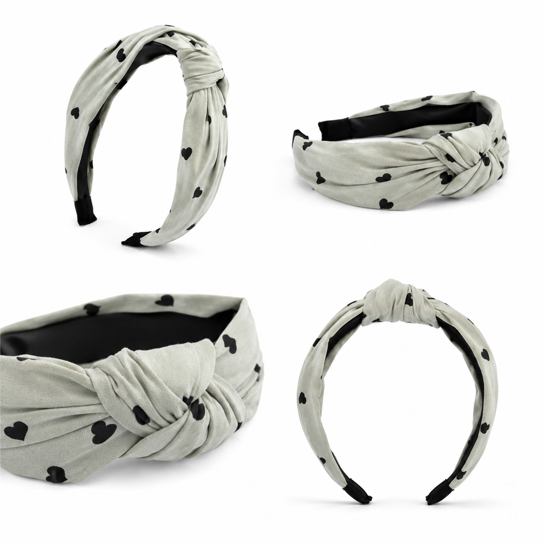 Soft sage green padded knotted headband with black heart print 