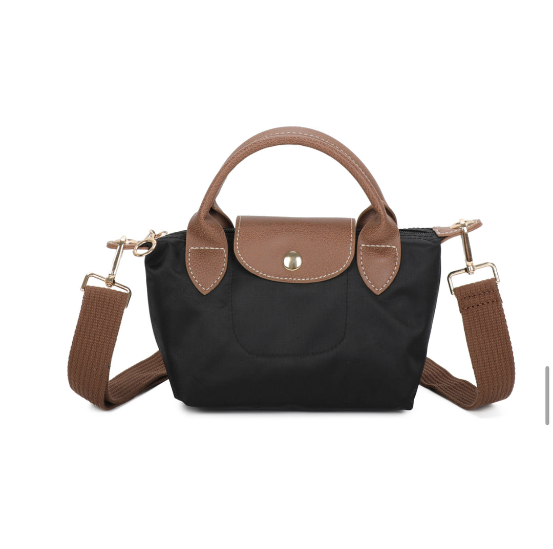 Black handbag with brown accents on a white background