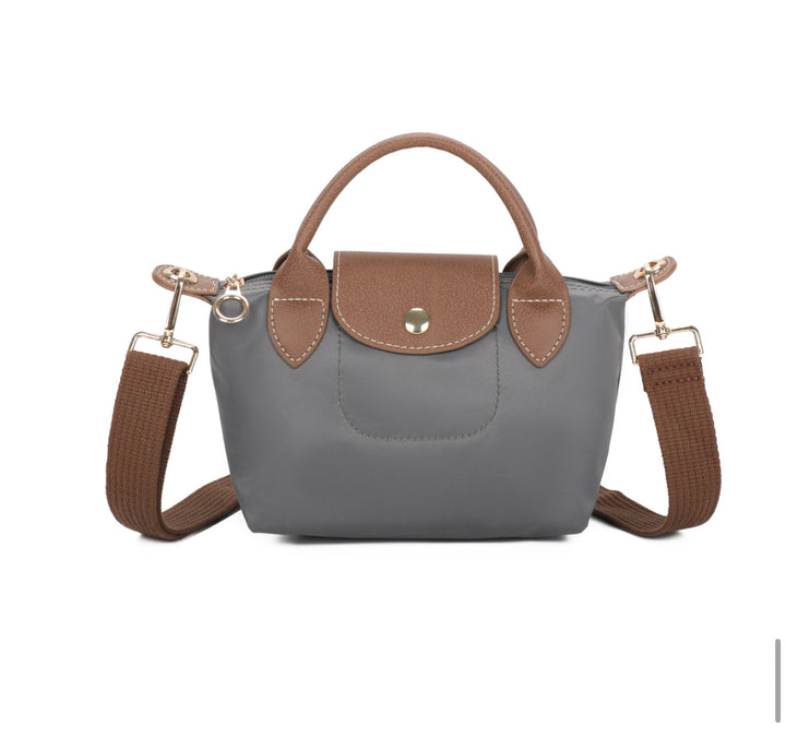 Grey handbag with brown accents on a white background