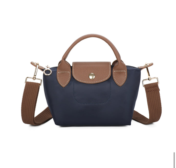 Navy handbag with brown accents on a white background