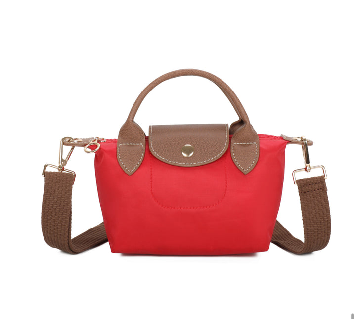 Red handbag with brown accents on a white background