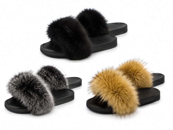 Four fluffy slide sandals arranged on a white background, each with a thick black footbed and strap covered in long fur. The fur colors are black, gray, and a warm camel tan.