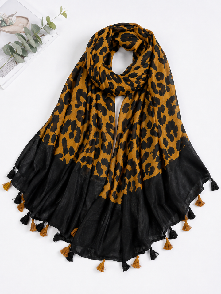 Mustard and black leopard print scarf with black border and tassel edging 