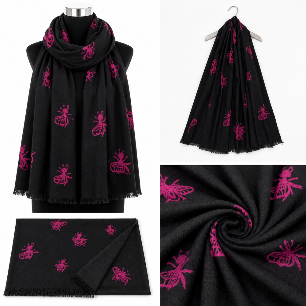 Black soft woven scarf with bright pink bee print and delicate fringed edging.