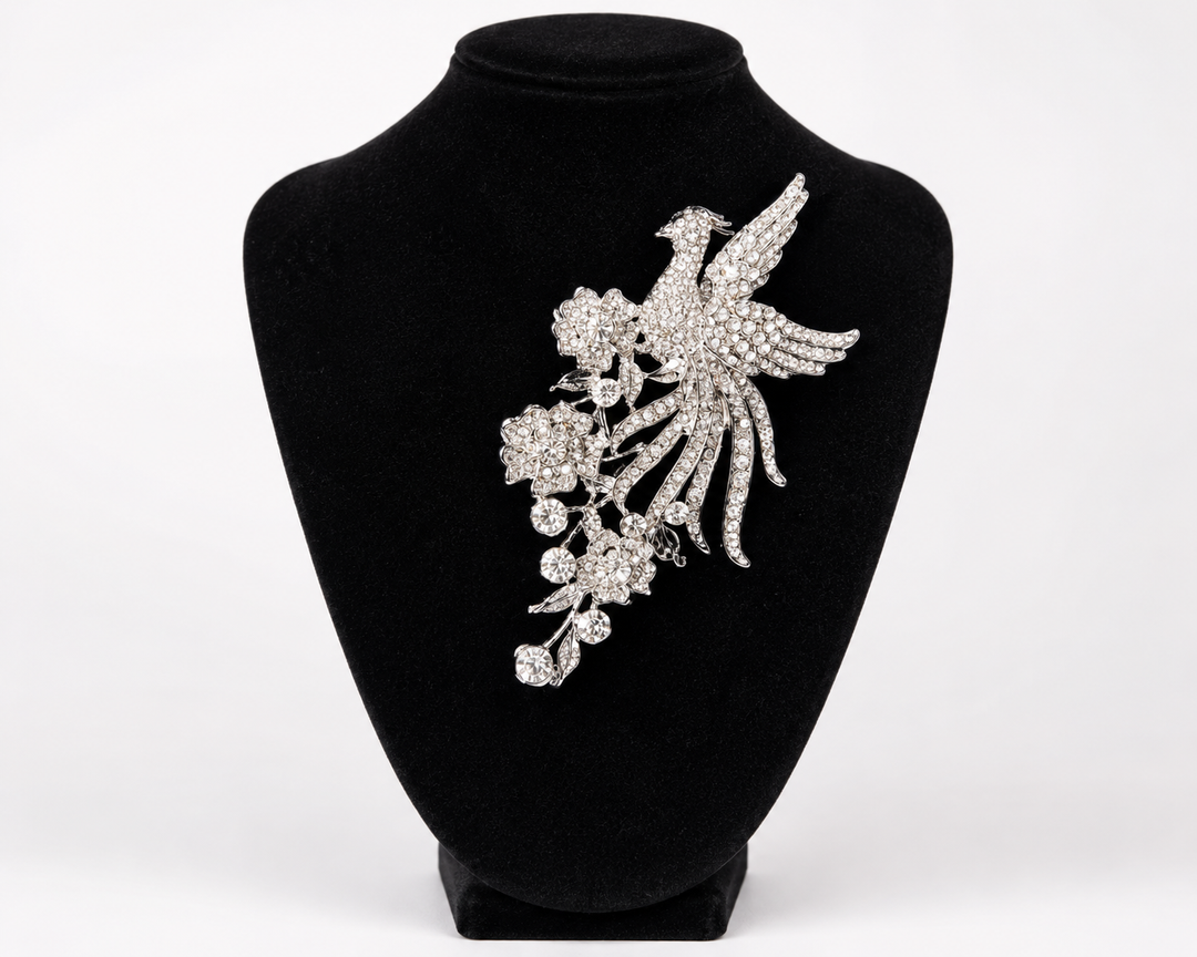 Silver crystal phoenix bird and floral statement brooch with cascading rhinestone detail