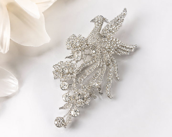Silver crystal phoenix bird and floral statement brooch with cascading rhinestone detail