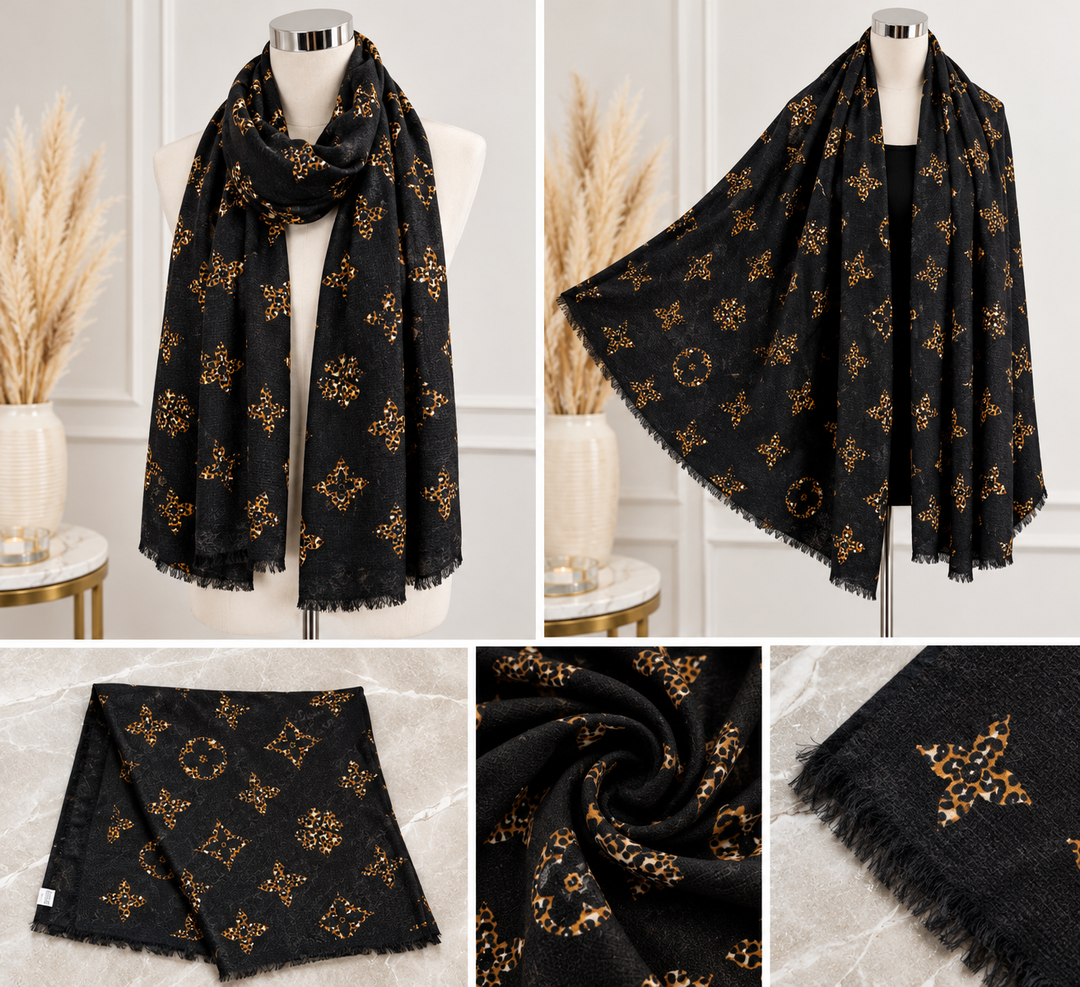 Black oversized statement scarf featuring golden brown leopard-print motifs, delicate fringed edges and soft lightweight fabric