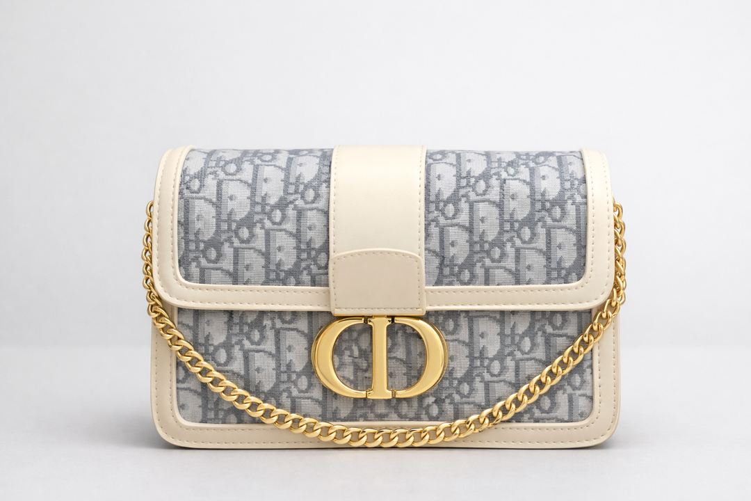 Designer inspired handbag with gold chain and gold buckle in white