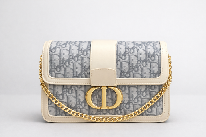 Designer inspired handbag with gold chain and gold buckle in white