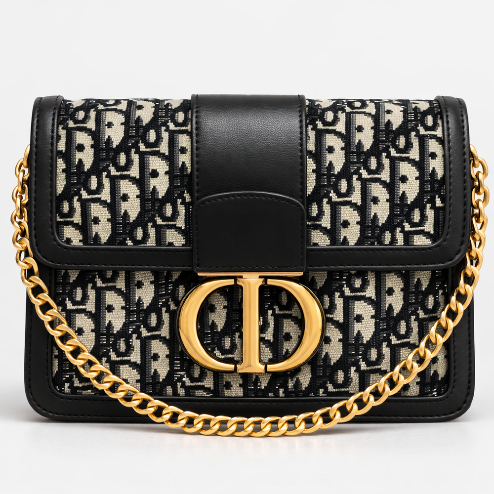 Designer handbag with black and beige pattern and gold chain strap