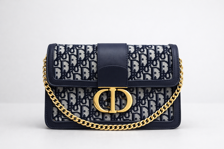 Designer handbag with gold chain and gold buckle 