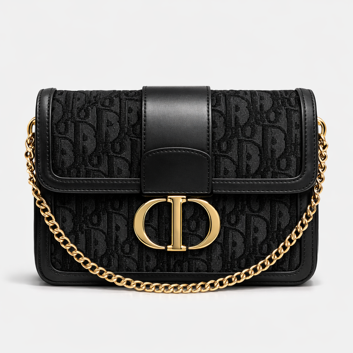 Black handbag with gold chain and gold buckle 