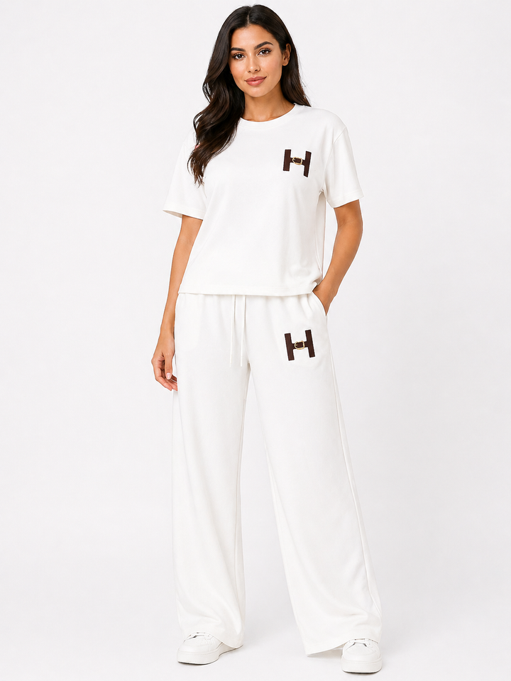 Woman wearing a white outfit with &