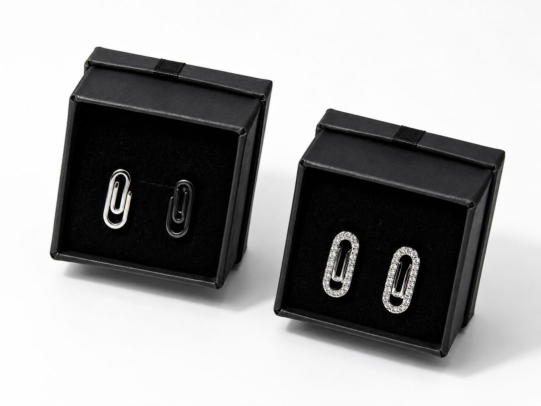 Minimalist silver and crystal paperclip earrings close-up