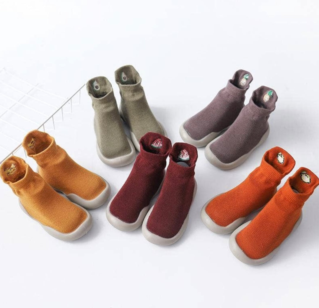 a collection of trainer socks for babies in different colours